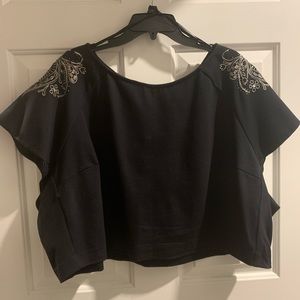 Black embellished crop top and high low skirt